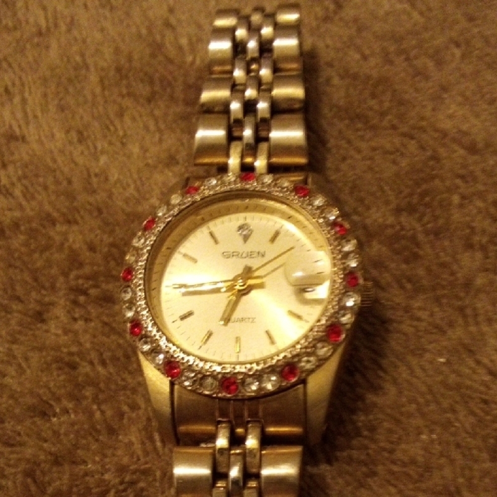 Gruen Quartz Gold Tone Watch Red Clear Rhinestone Bezel Date Window PW175